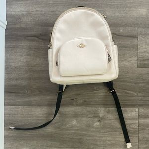 Cream and black Coach backpack